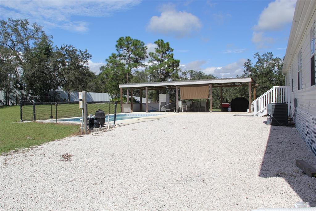 13127 Star Road Brooksville, FL 34613 - Photo 12 of 54 front view of a house with a patio