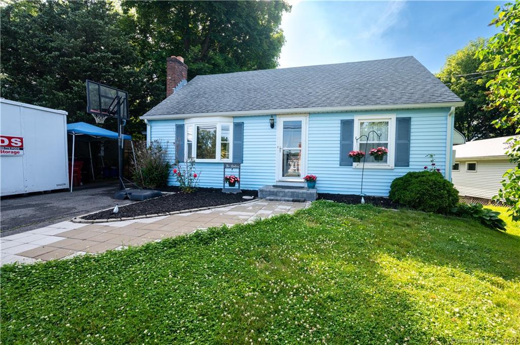 Beautiful new landscaping and paver walkway with front steps.