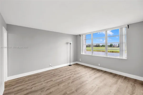 a view of an empty room with a window
