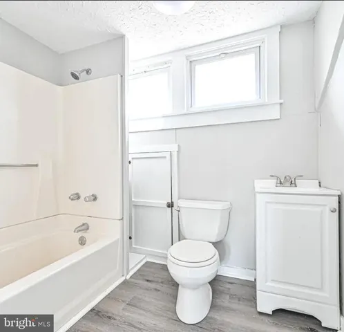 a bathroom with a toilet sink and a bathtub