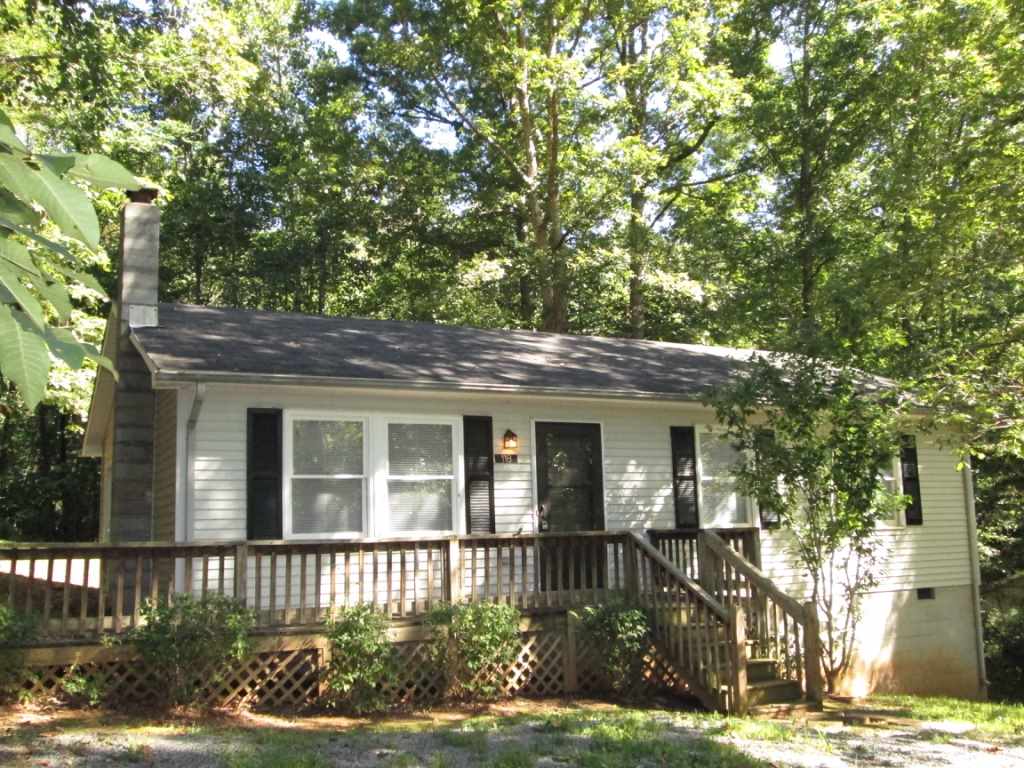 118 Village Road Shipman, VA 22971 - Photo 3 of 16 a front view of a house with a yard