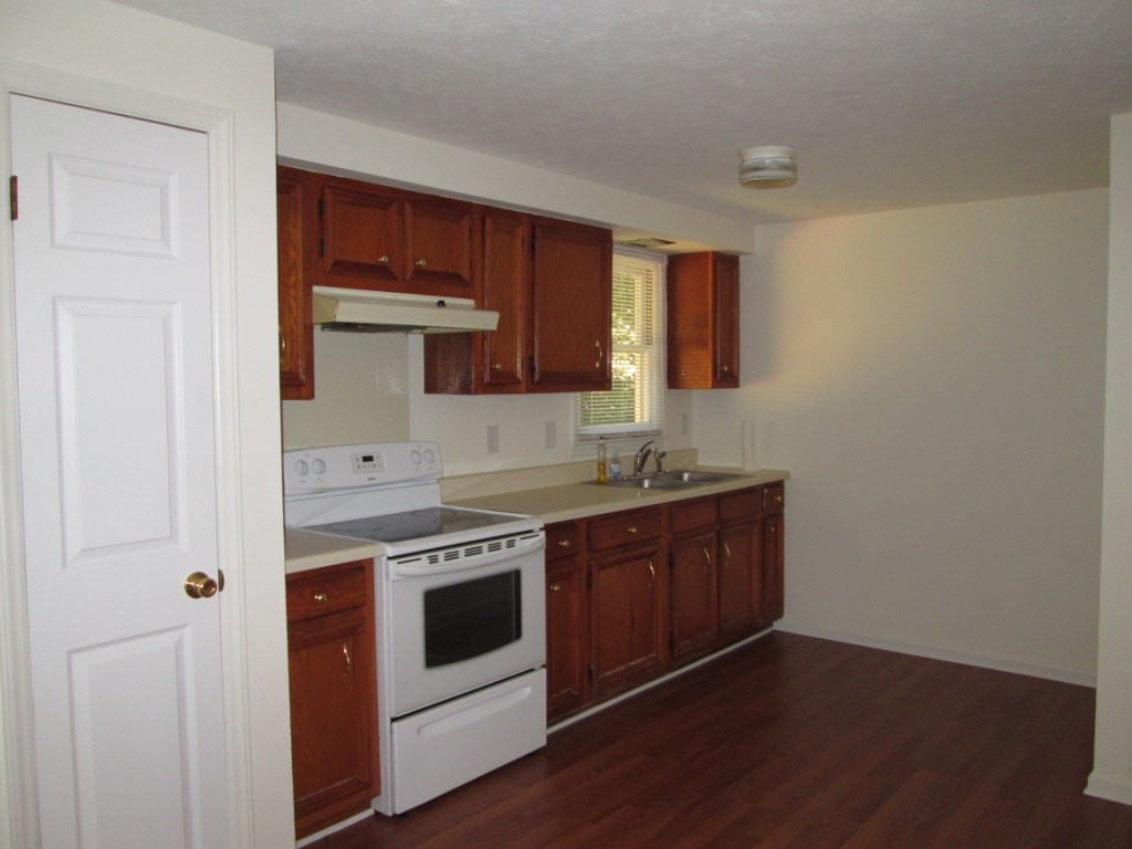 118 Village Road Shipman, VA 22971 - Photo 8 of 16 a kitchen with stainless steel appliances granite countertop a stove and a sink