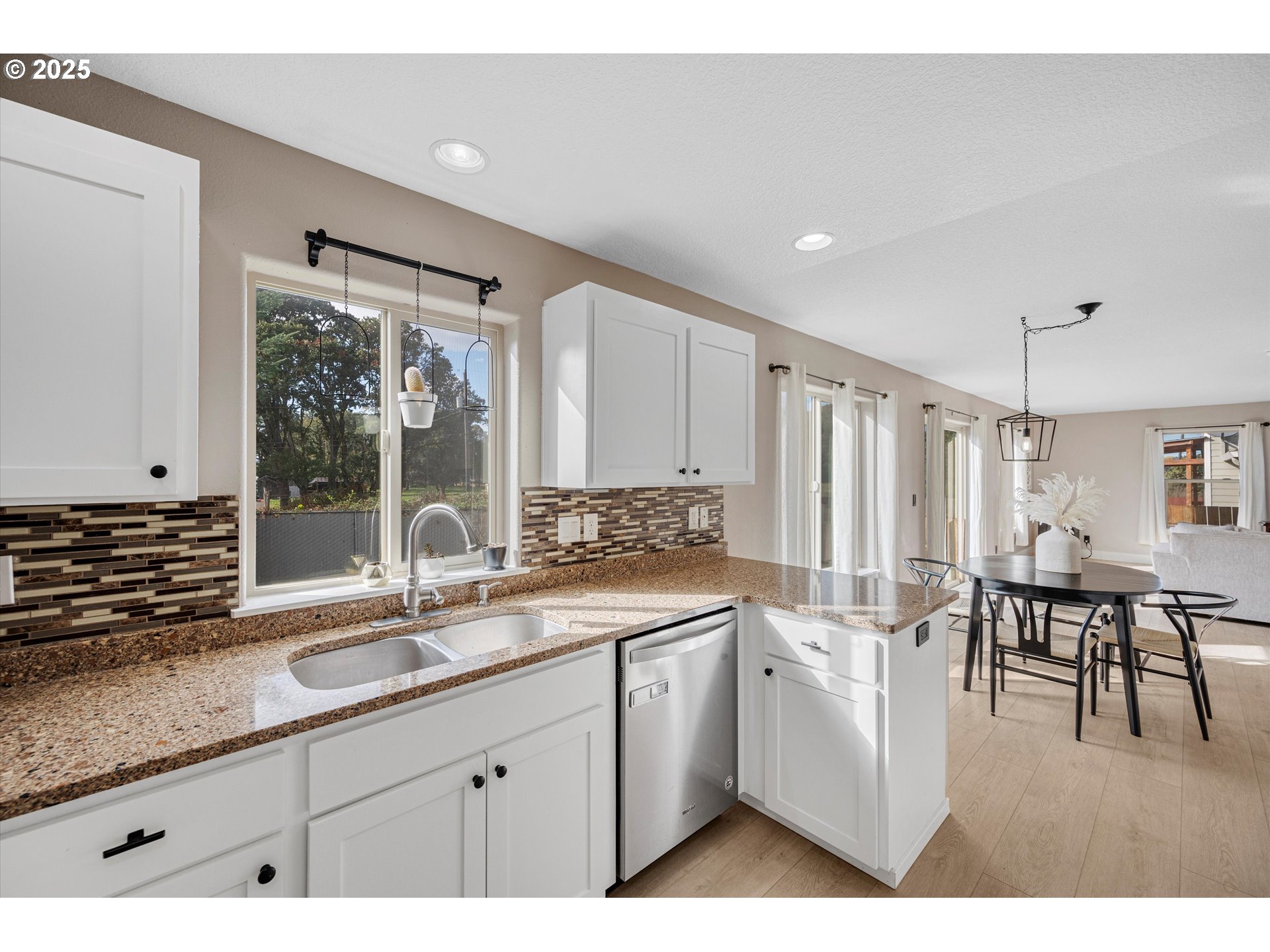 968 Salamander Road Southeast Jefferson, OR 97352 - Photo 15 of 32 a kitchen with sink cabinets and dining table