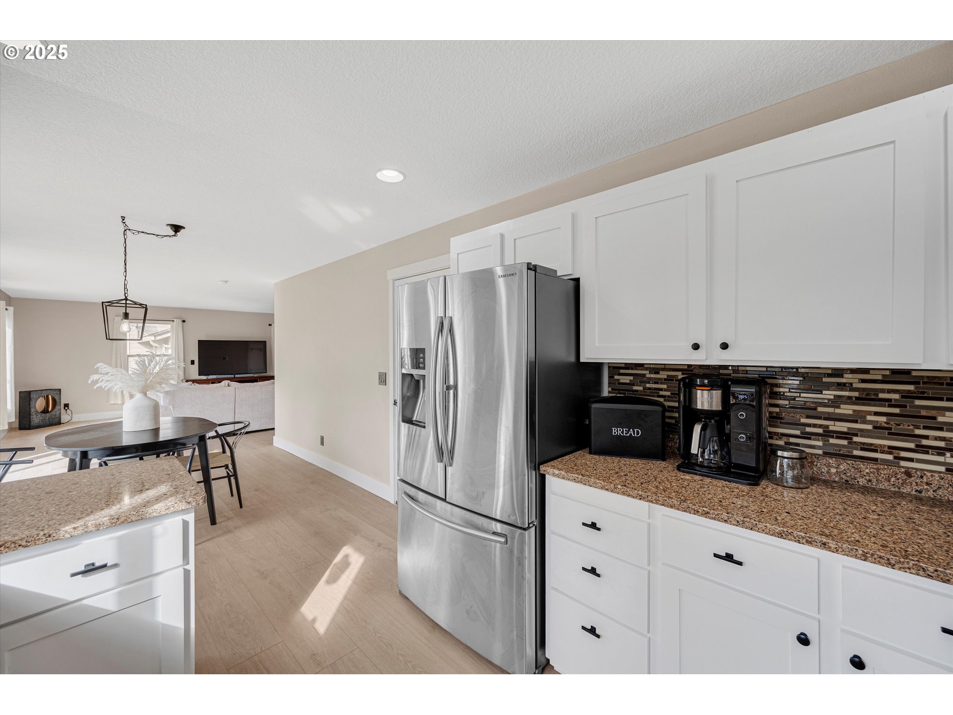 968 Salamander Road Southeast Jefferson, OR 97352 - Photo 16 of 32 a kitchen with stainless steel appliances a refrigerator sink and cabinets