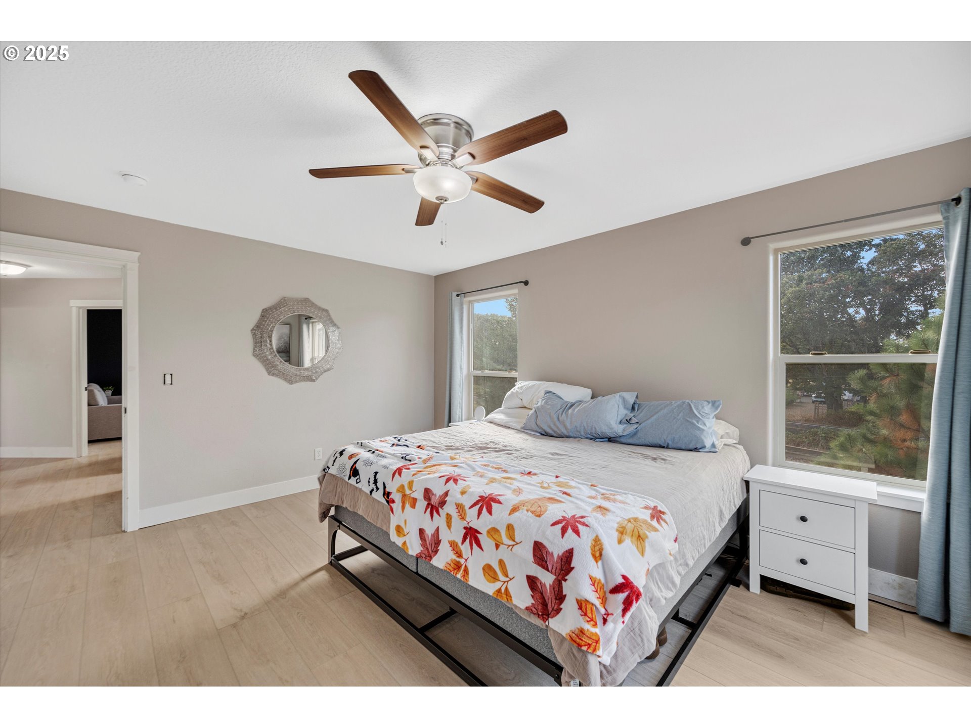 968 Salamander Road Southeast Jefferson, OR 97352 - Photo 23 of 32 a bedroom with a bed a window and a chandelier