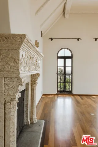 a view of an entryway with wooden floor