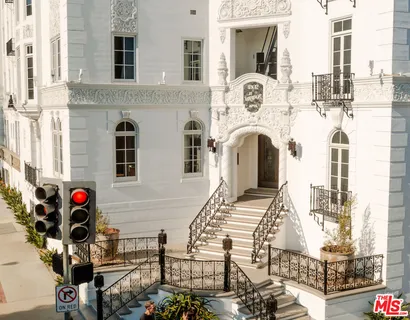 a front view of a building with many windows
