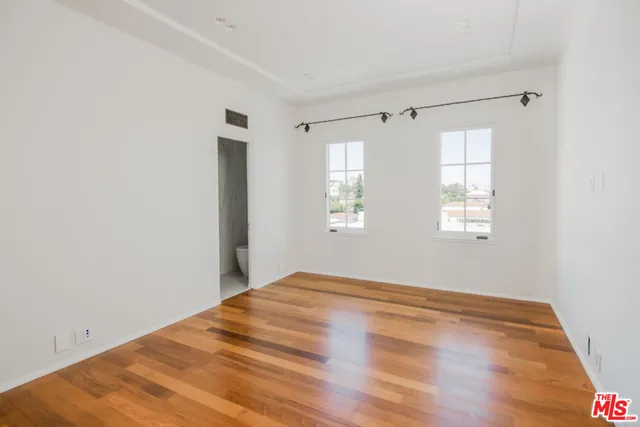 a view of a hallway with a chandelier