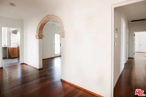 a view of a living room with wooden floor