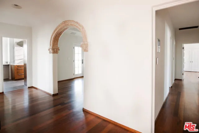 a view of a living room with wooden floor