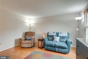 17 Devon Court Sterling, VA 20165 - Photo 3 of 30 a living room with furniture and a wooden floor