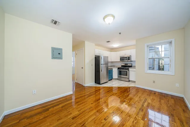 a view of kitchen with wooden floor