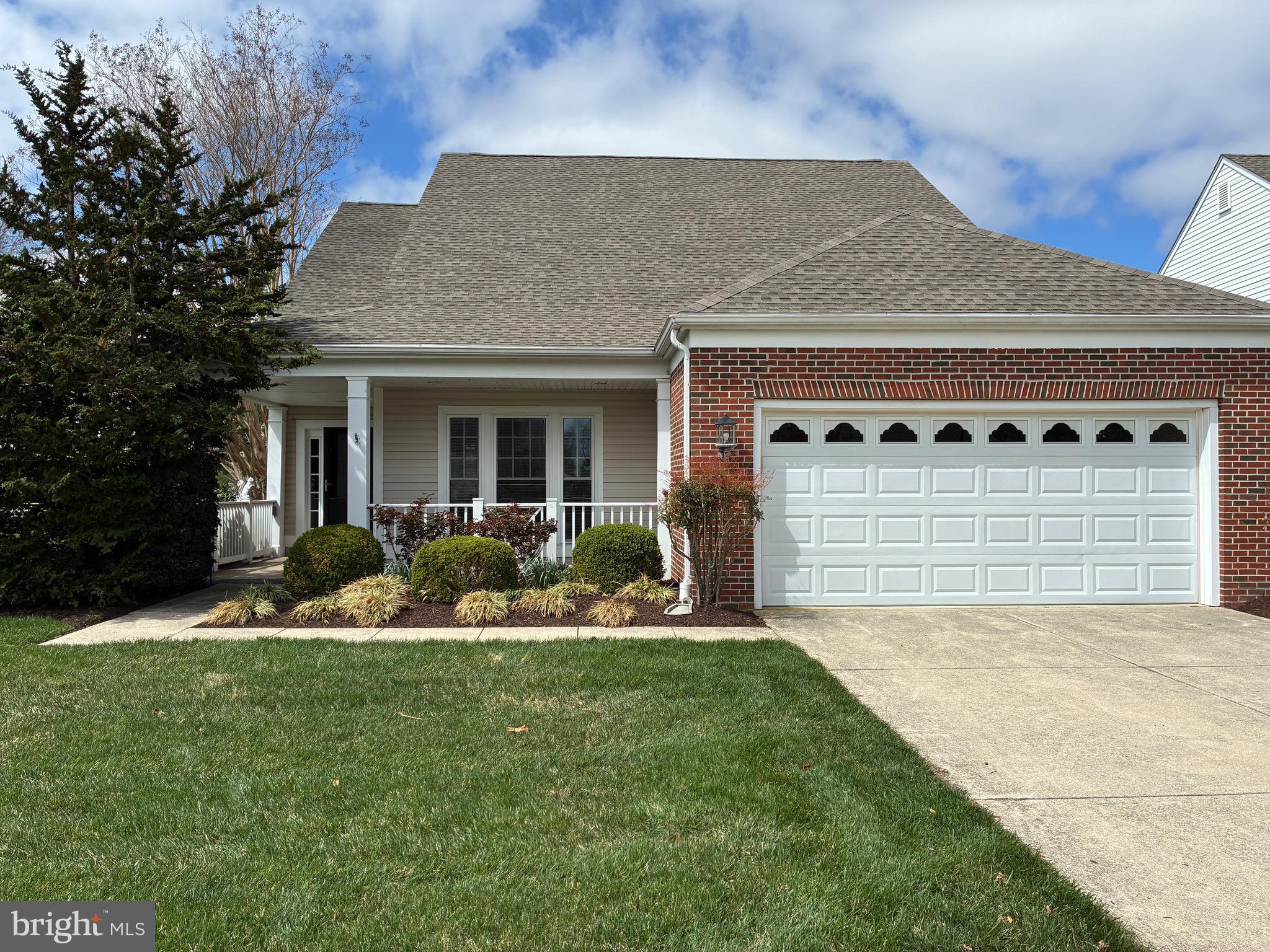 34825 Capstan Lane Lewes, DE 19958 - Photo 1 of 24 a front view of a house with a yard and garage