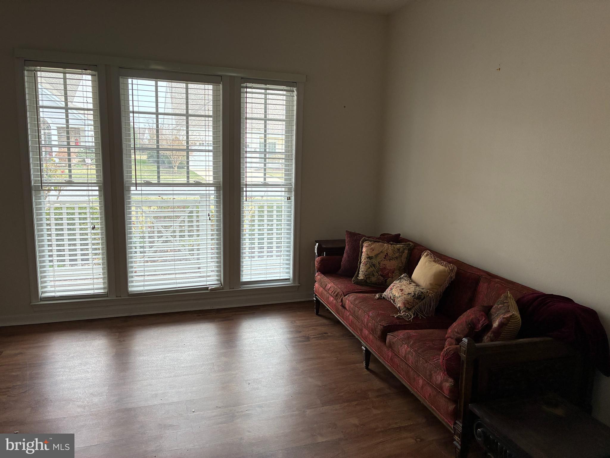 34825 Capstan Lane Lewes, DE 19958 - Photo 11 of 24 a living room with couch and a large window