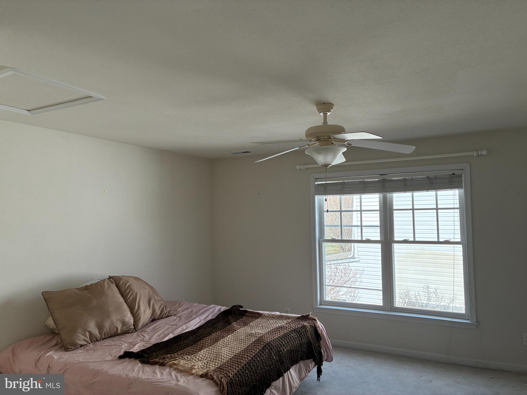 34825 Capstan Lane Lewes, DE 19958 - Photo 16 of 24 a bedroom with a bed and window