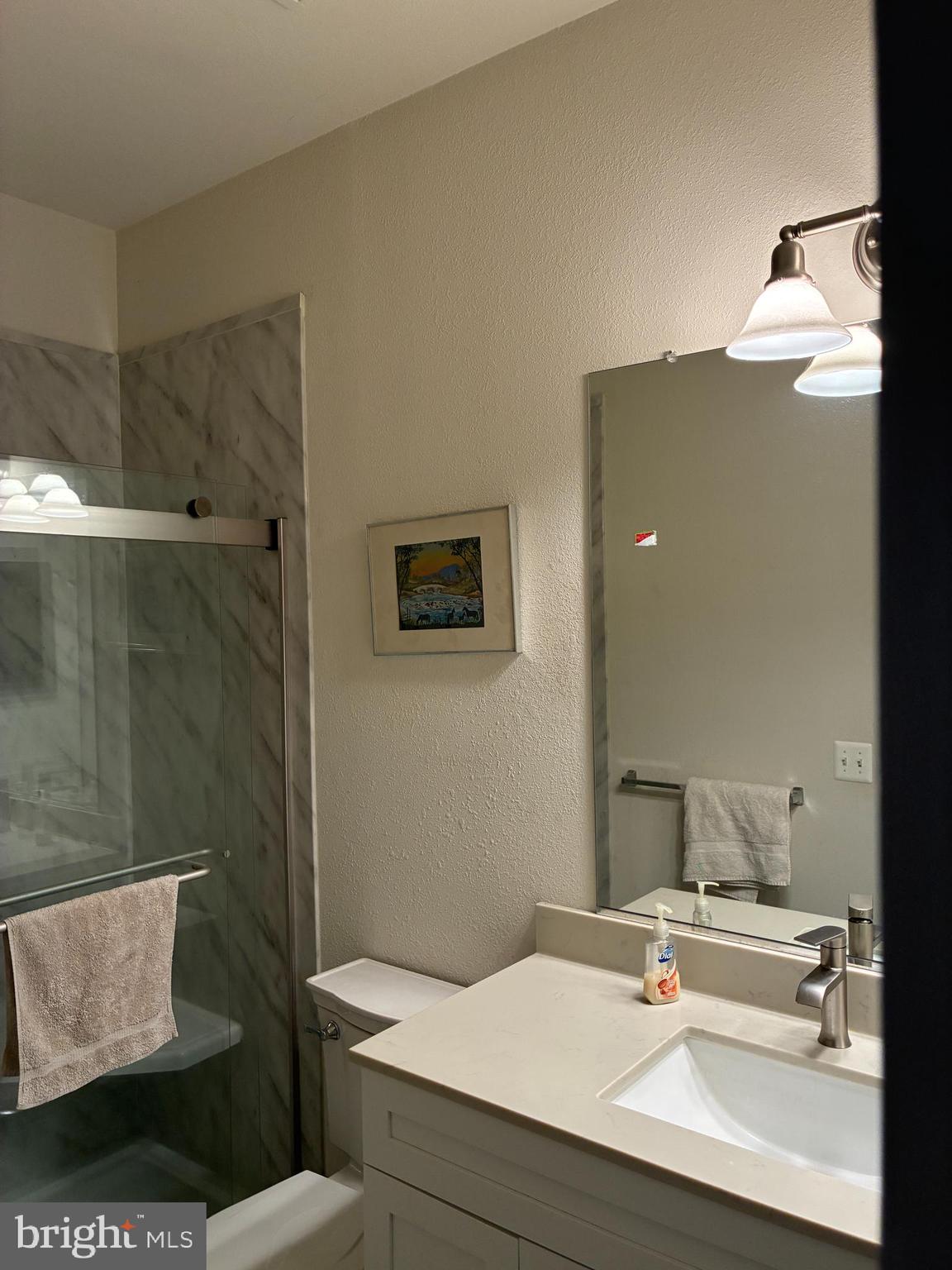 34825 Capstan Lane Lewes, DE 19958 - Photo 23 of 24 a bathroom with a sink and a mirror