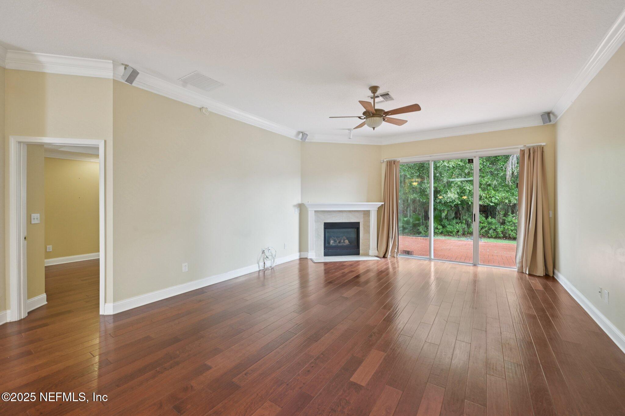 1734 Covington Lane Fleming Island, FL 32003 - Photo 15 of 54 a view of an empty room with wooden floor and a window