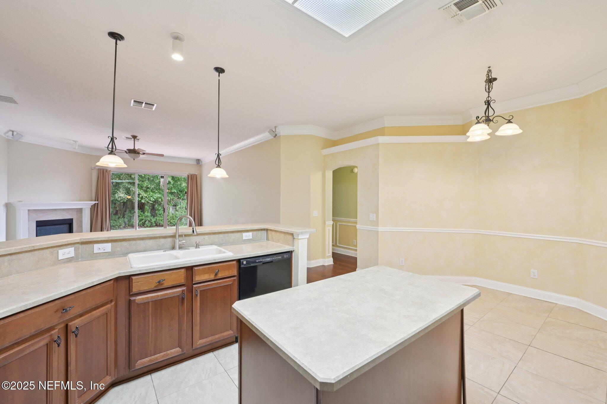 1734 Covington Lane Fleming Island, FL 32003 - Photo 20 of 54 a kitchen with a sink a counter top space and appliances