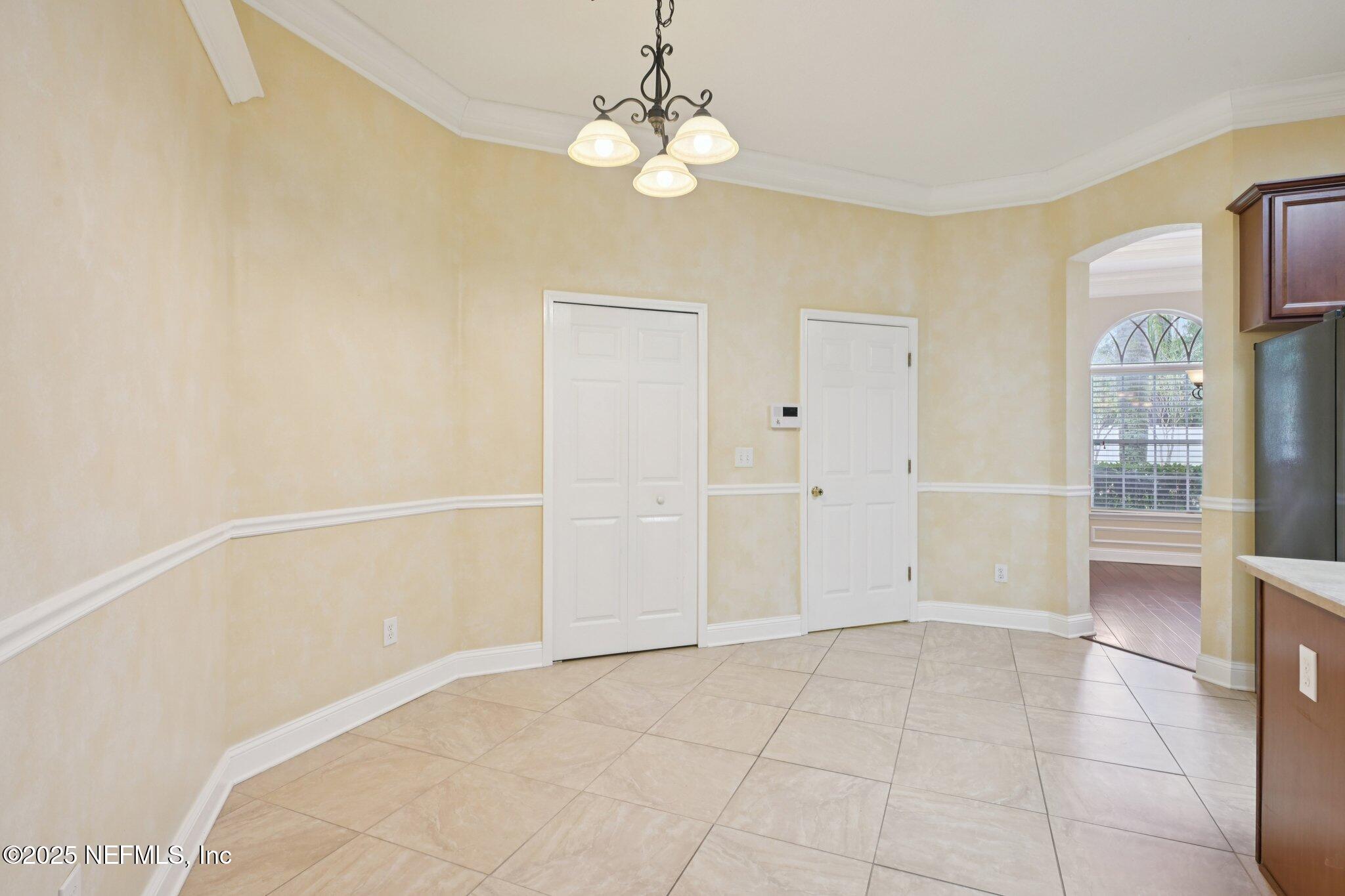 1734 Covington Lane Fleming Island, FL 32003 - Photo 21 of 54 a view of an empty room with a window