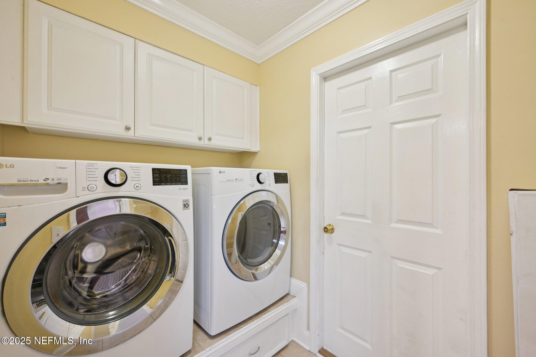 1734 Covington Lane Fleming Island, FL 32003 - Photo 37 of 54 a utility room with dryer and washer