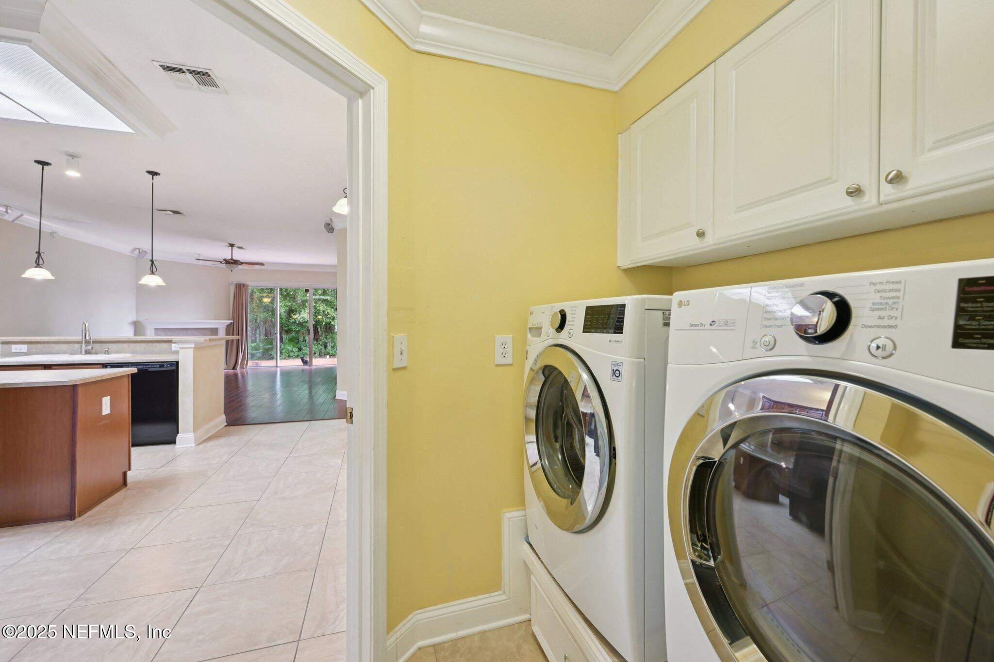 1734 Covington Lane Fleming Island, FL 32003 - Photo 38 of 54 a view of a storage & utility room with washer and dryer