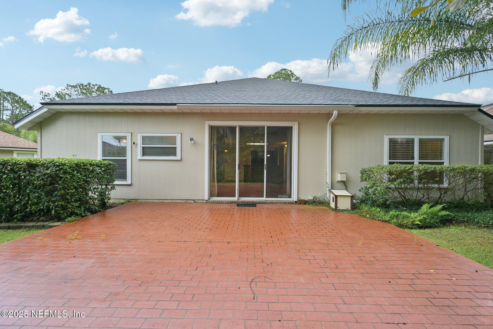 1734 Covington Lane Fleming Island, FL 32003 - Photo 40 of 54 front view of a house with a garden