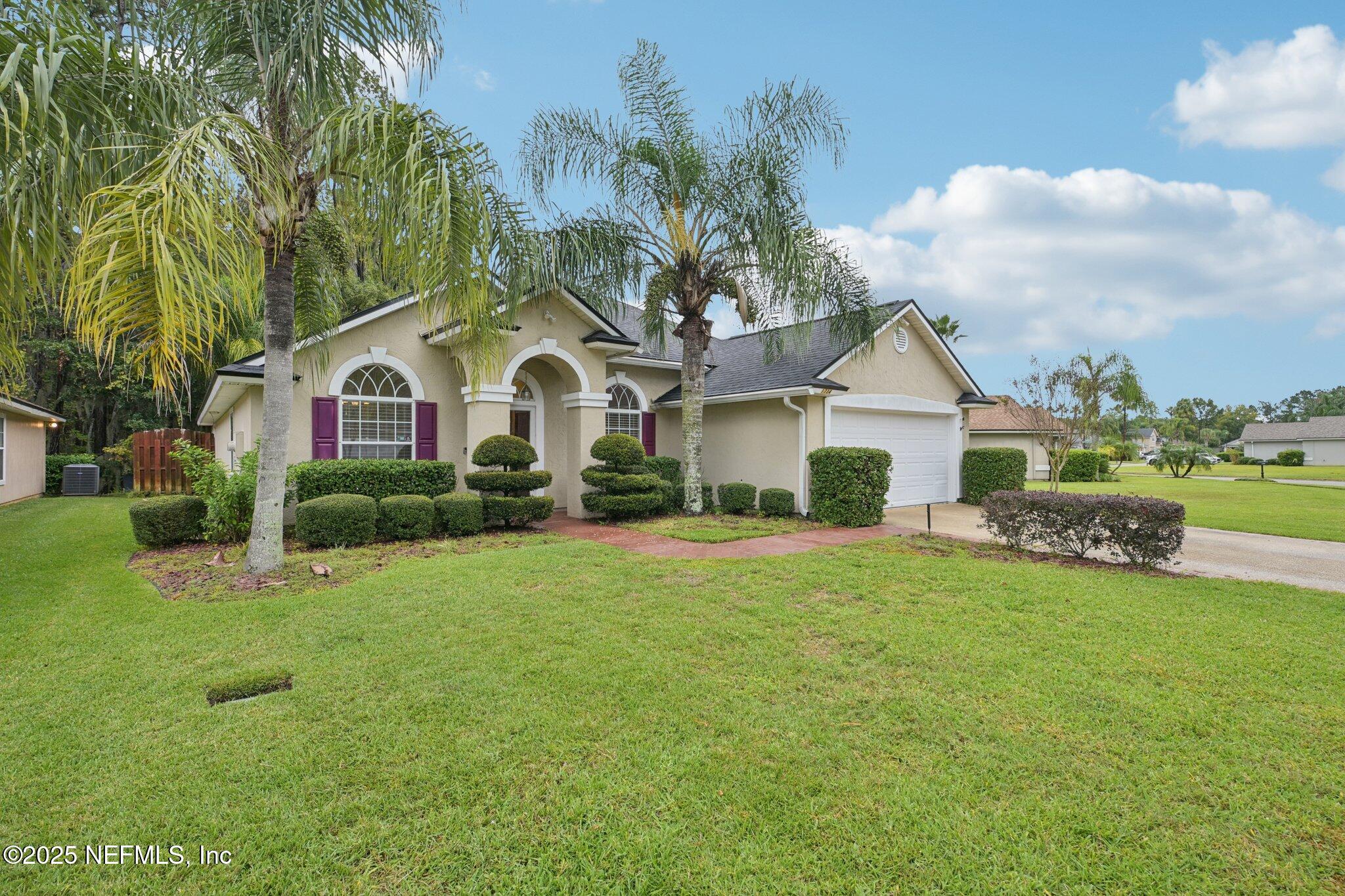 1734 Covington Lane Fleming Island, FL 32003 - Photo 45 of 54 a front view of a house with garden