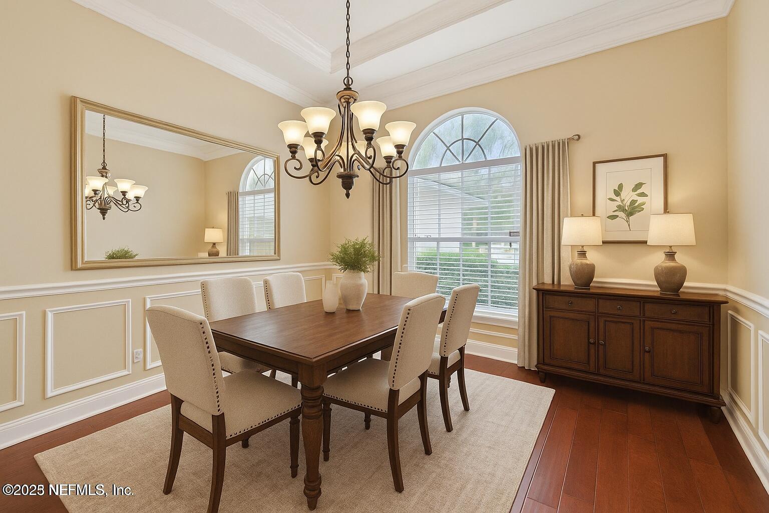 1734 Covington Lane Fleming Island, FL 32003 - Photo 7 of 54 a view of a dining room with furniture window and wooden floor