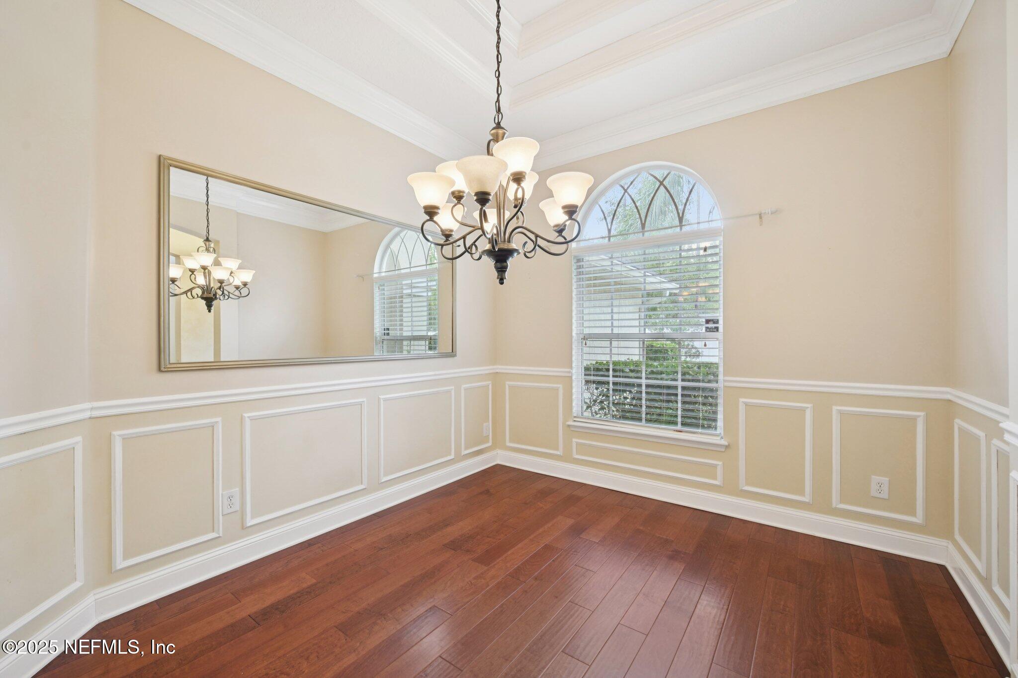 1734 Covington Lane Fleming Island, FL 32003 - Photo 8 of 54 a view of an empty room with wooden floor and a window