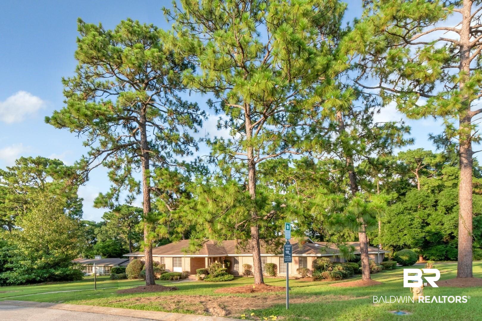 241 Suzanne Circle Mobile, AL 36608 - Photo 41 of 41 Ranch-style home with a front lawn and view of wooded area
