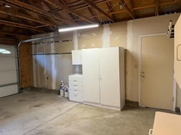 a view of a room with wooden walls