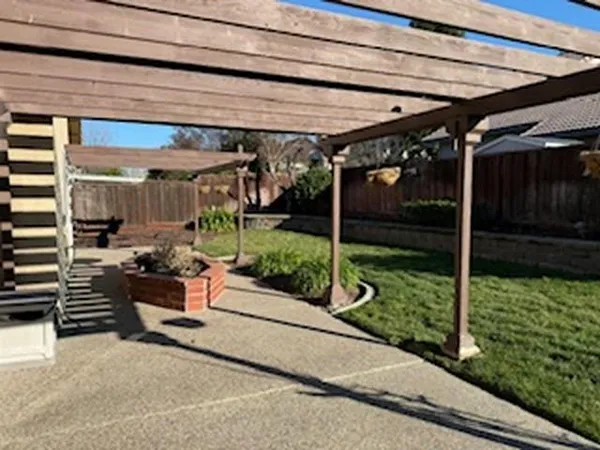 a view of a couches in the backyard of a house
