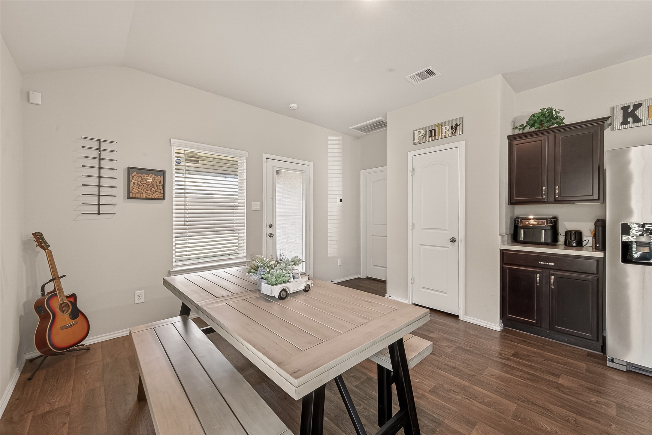 2407 Hartsel Frst Trail Spring, TX 77373 - Photo 14 of 26 a kitchen with a table chairs and refrigerator