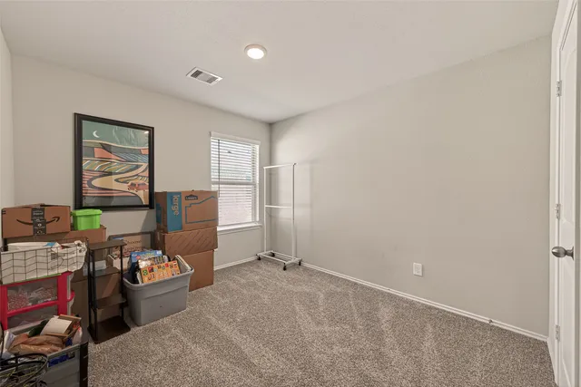 a view of a workspace with furniture