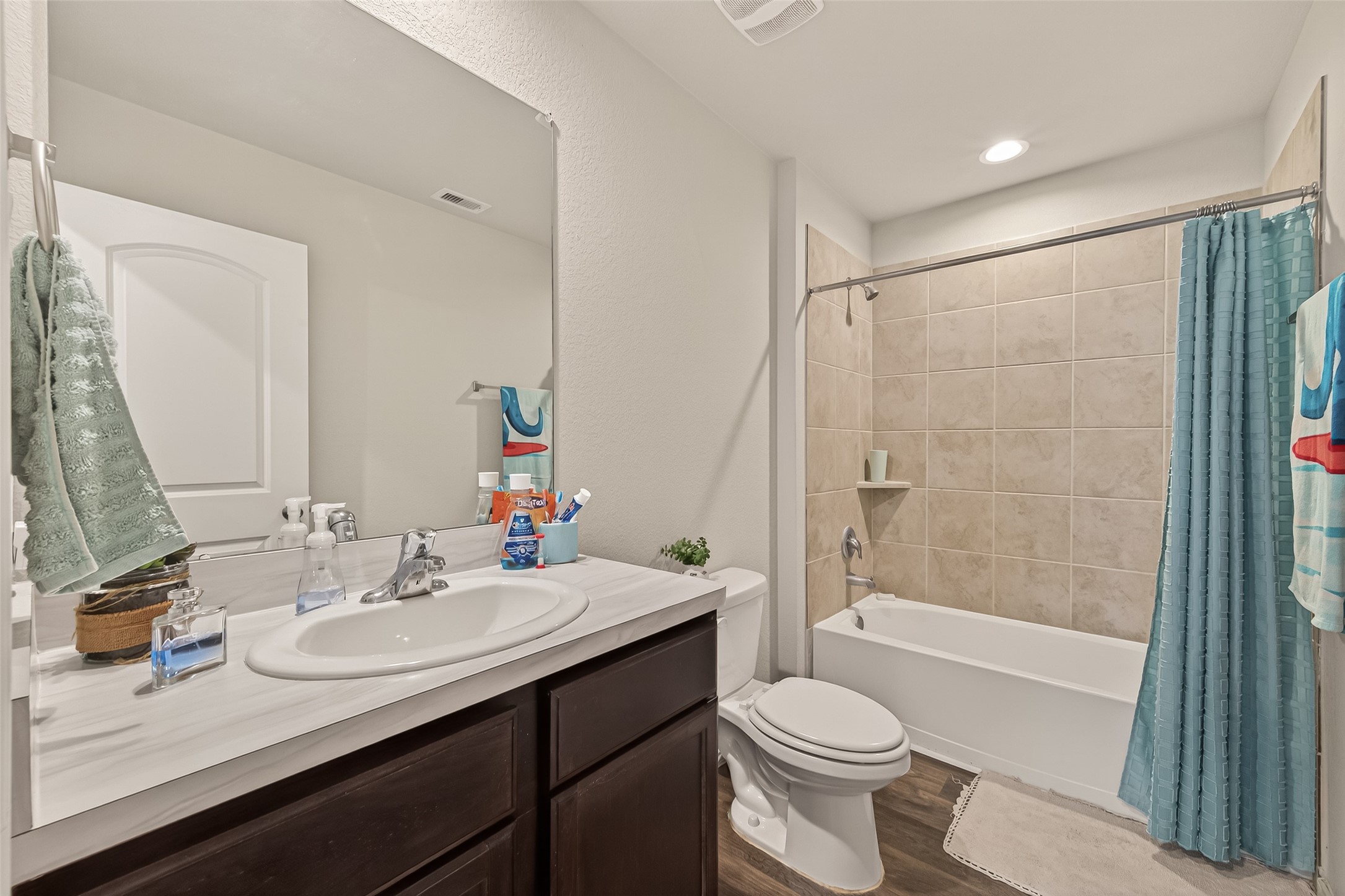 2407 Hartsel Frst Trail Spring, TX 77373 - Photo 19 of 26 a bathroom with a sink a toilet and shower a mirror