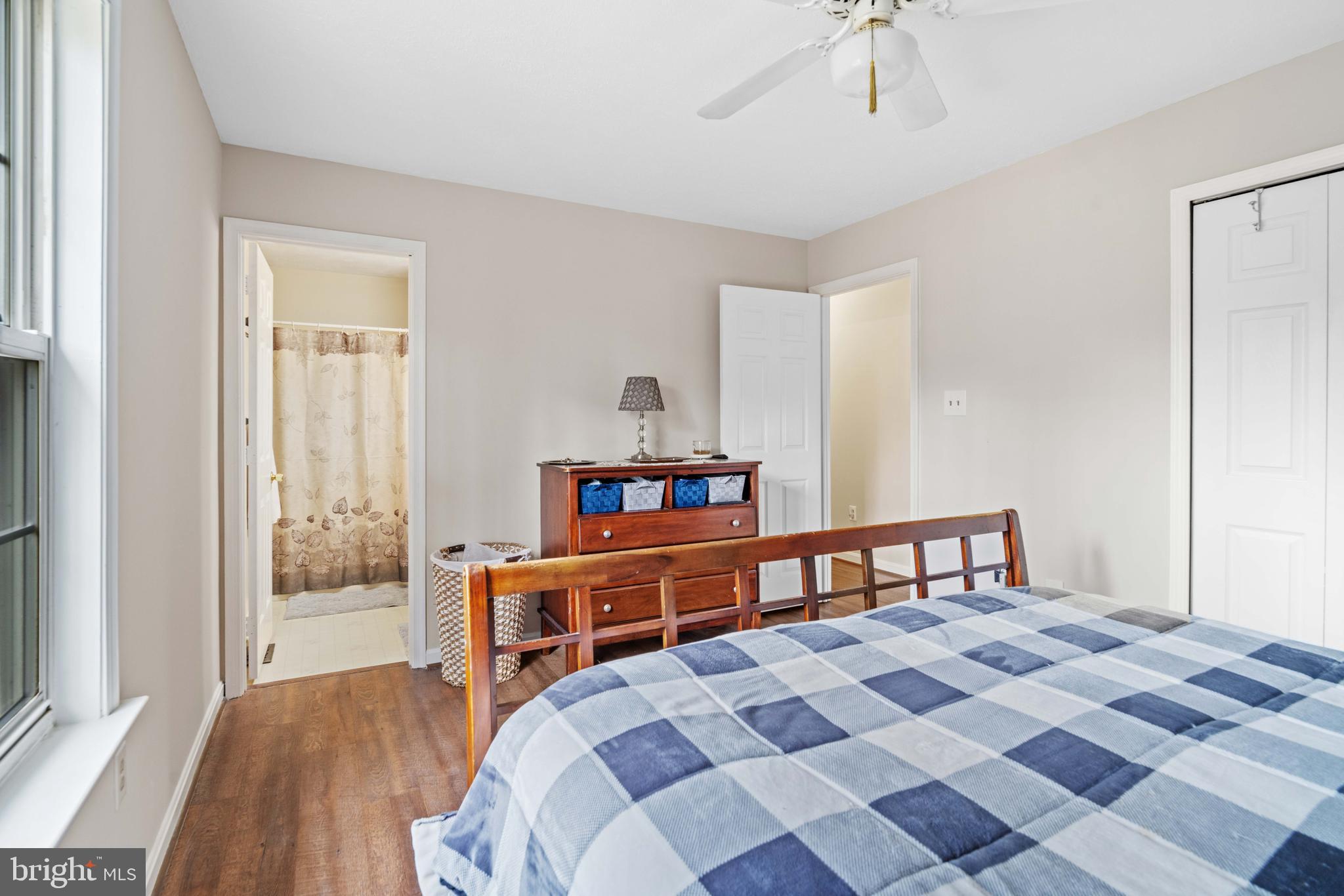 11551 San Rafael Road Lusby, MD 20657 - Photo 12 of 31 a bedroom with a bed and wooden floor