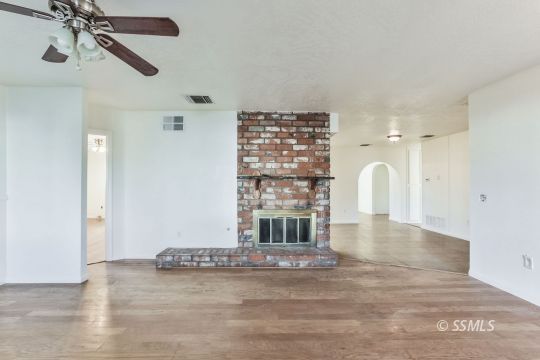 712 South Alvord Street Ridgecrest, CA 93555 - Photo 5 of 33 a view of a room with a fireplace and cabinets