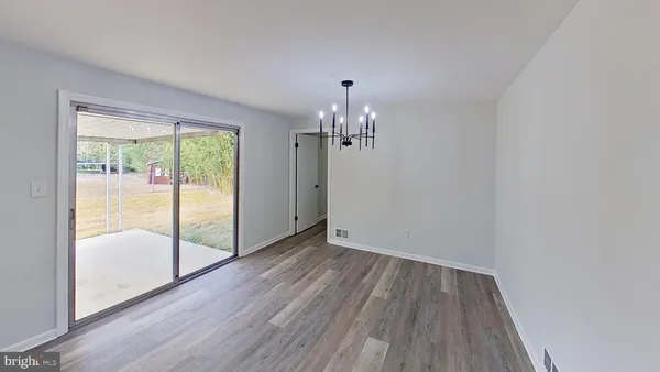 a view of a room with wooden floor and balcony