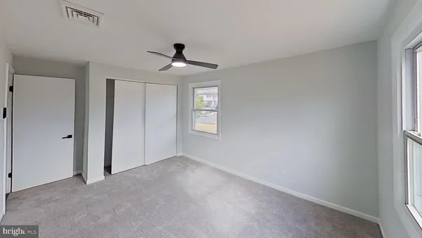 a view of empty room with windows