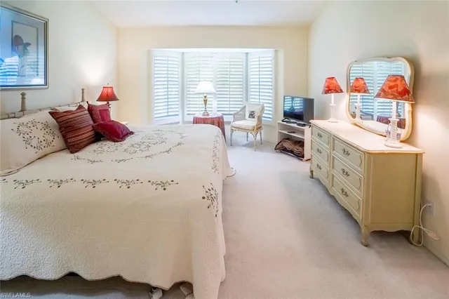 a bed room with a bed and a furniture