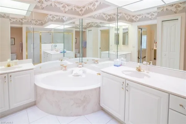 a bathroom with a sink double vanity and a mirror