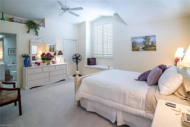 a bedroom with bed and window