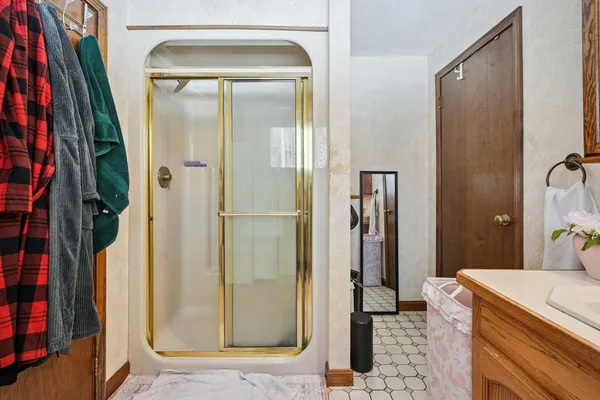 a bathroom with a shower and a mirror