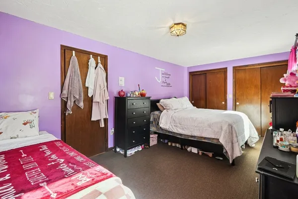 a bed room with a bed and a tv