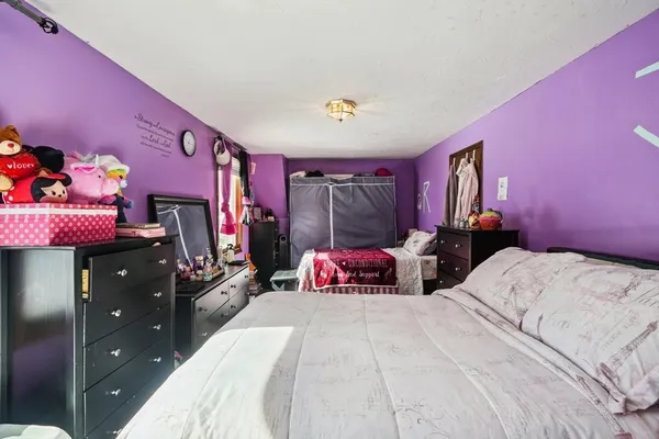 a bedroom with a bed and a closet