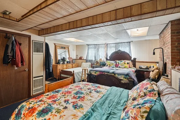 a bed room with a bed and a dresser