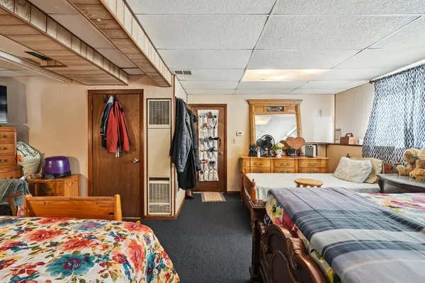 a bedroom with a bed and a walk in closet