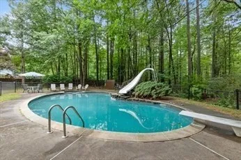 a view of a swimming pool in a backyard