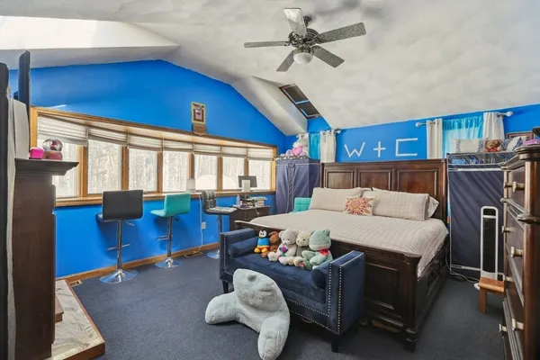 a bed room with furniture and a chandelier