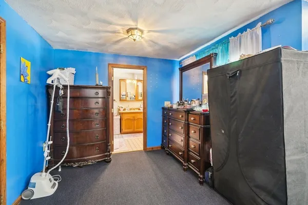 a room with furniture a ceiling fan and a window